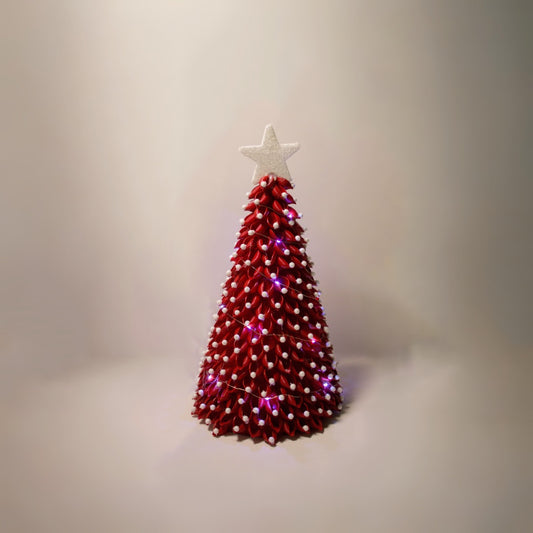 Red christmas tree with white ornaments, white lights and white star.