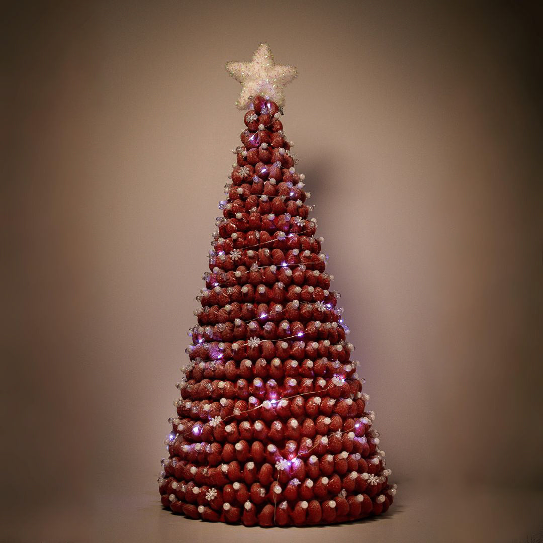 Red Christmas tree with white ornaments and white lights.